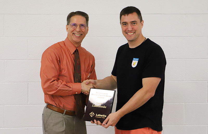 Labette Community College President, Dr. Mark Watkins on left, presented Luke Henke, right , with the 2021 Distinguished Adjunct Faculty of the Year Award.