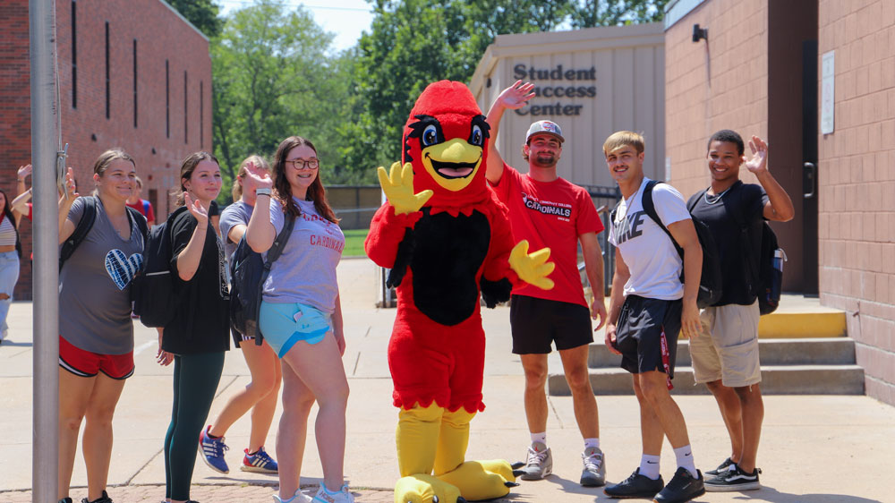 Chris the Cardinal with Students